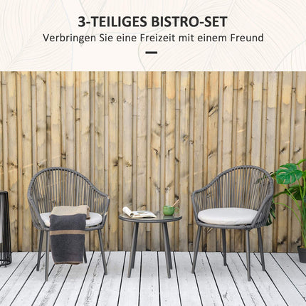 Rattan garden furniture - 2 chairs and table, cushions included