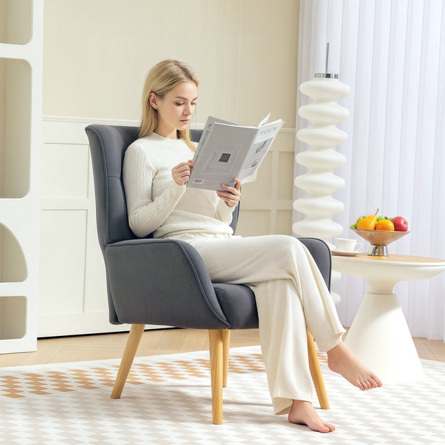 Gray velvet armchair with wooden legs for living room
