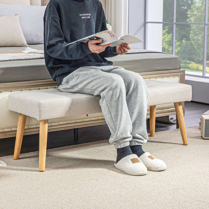 Cream-covered bench with wooden legs, 120 x 41 x 43 cm