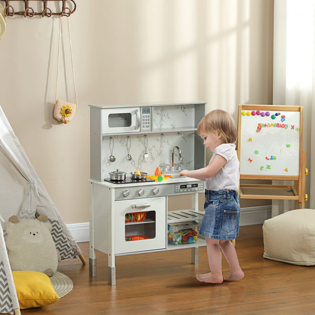 Adjustable play kitchen for children with stove and accessories
