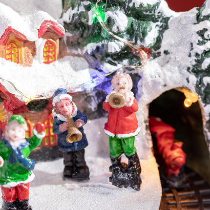 Christmas village with LED lights and moving train