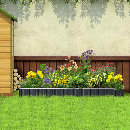 Steel raised garden bed with plant signs and gloves