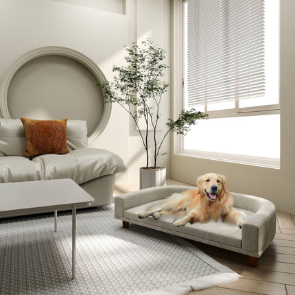Dog sofa with cushion, raised design and wooden legs, gray