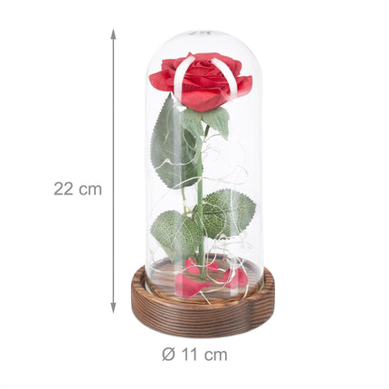 Eternal rose in glass with candle