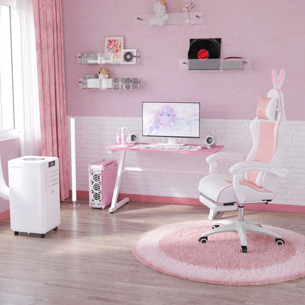 Pink ergonomic gaming chair with lumbar support and footrest