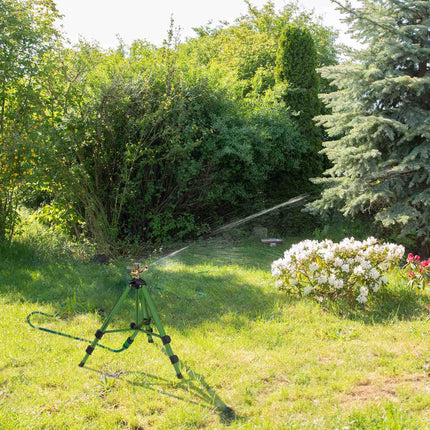 Green sprinkler with metal stand