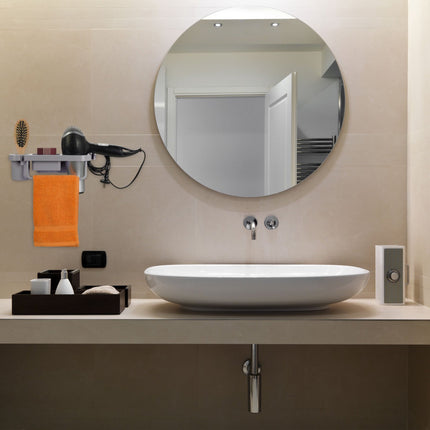 Hair dryer holder for the wall
