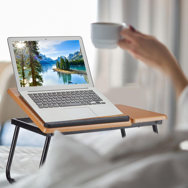 Laptop table with tiltable work surface