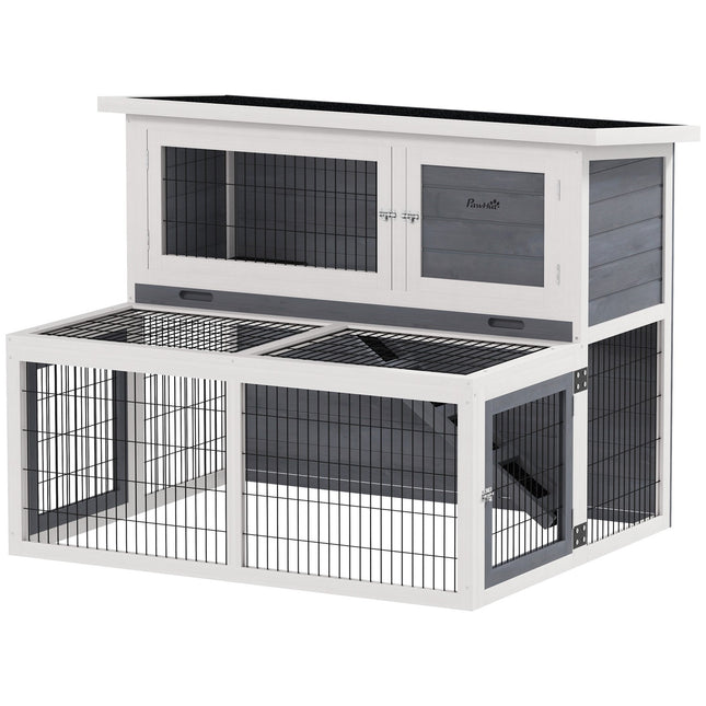 Two-story rabbit hutch with outdoor enclosure