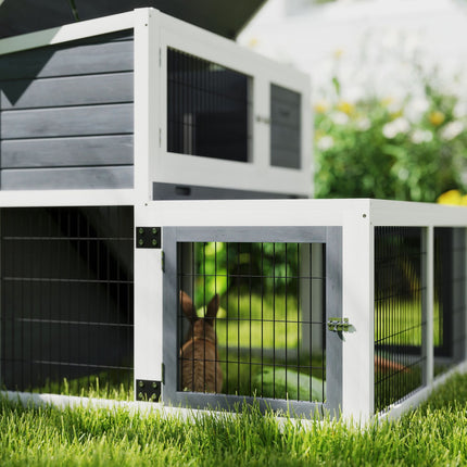Two-story rabbit hutch with outdoor enclosure