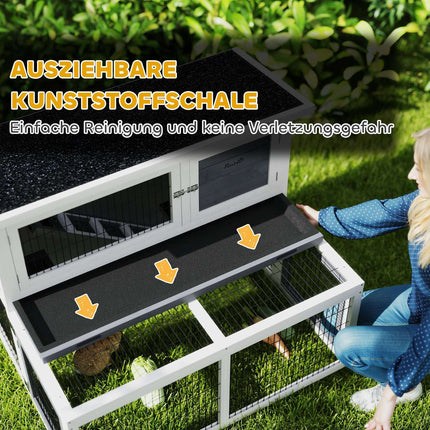 Two-story rabbit hutch with outdoor enclosure