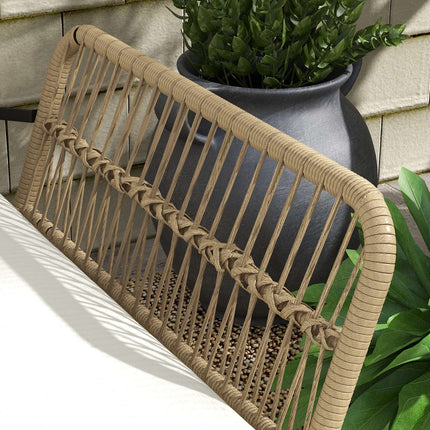 Rattan garden furniture with chair, table and cushions