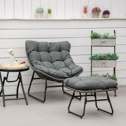 Outdoor rattan relaxation chair with footstool and gray cushions