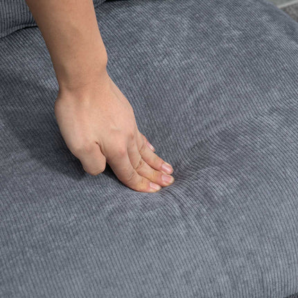 Reclining gray armchair with adjustable backrest and ottoman