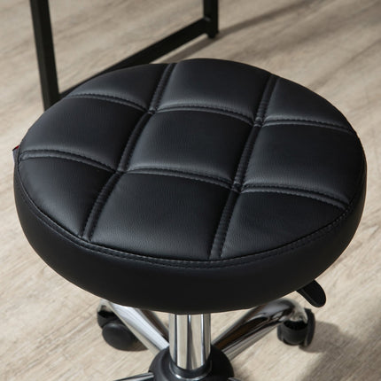 Height-adjustable salon stool in black artificial leather