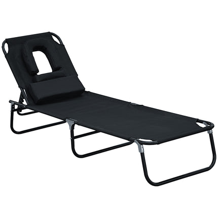 Black sun lounger with face opening for relaxation