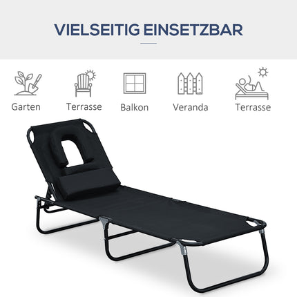 Black sun lounger with face opening for relaxation