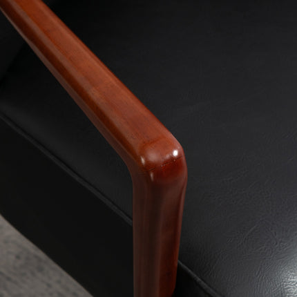 Upholstered chair in artificial leather, upholstered with armrests