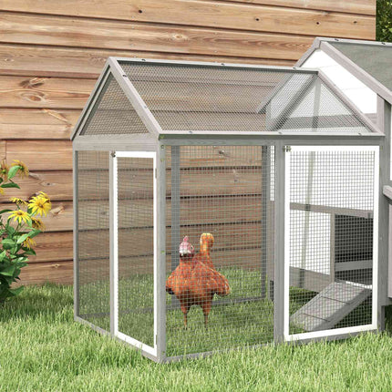 Gray wooden chicken house with nesting box and ramp