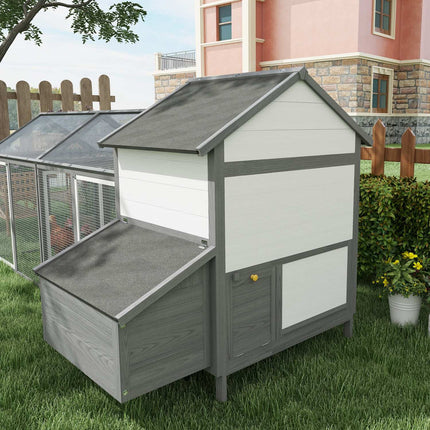 Gray wooden chicken house with nesting box and ramp