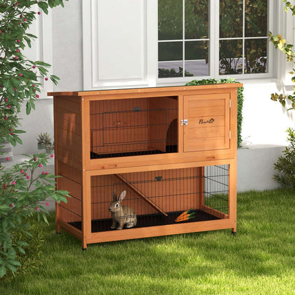 2-story wooden rabbit hutch with outdoor ramp